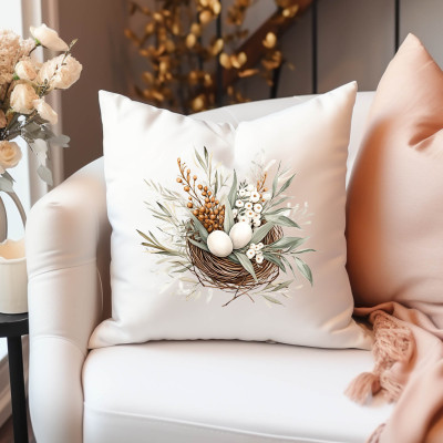 Bílý polštářek z mikrovlákna s velikonočním obrázkem hnízda z proutí v rustikálním stylu.